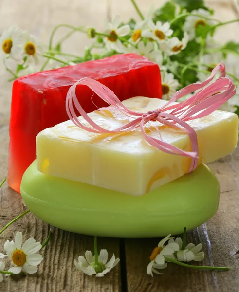 Handmade soap with flowers on the organic background