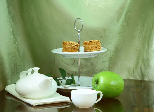 Pretty cake stand with elegant china tea set