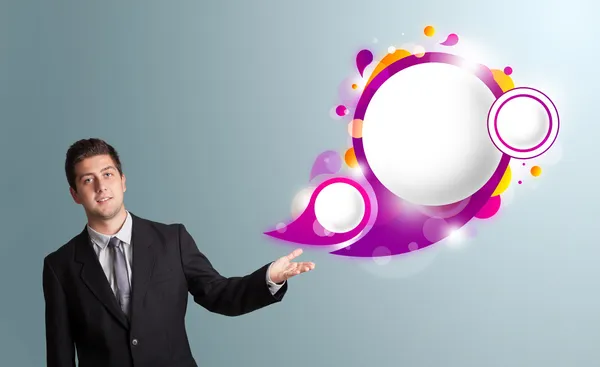 Handsome man presenting abstract speech bubble copy space