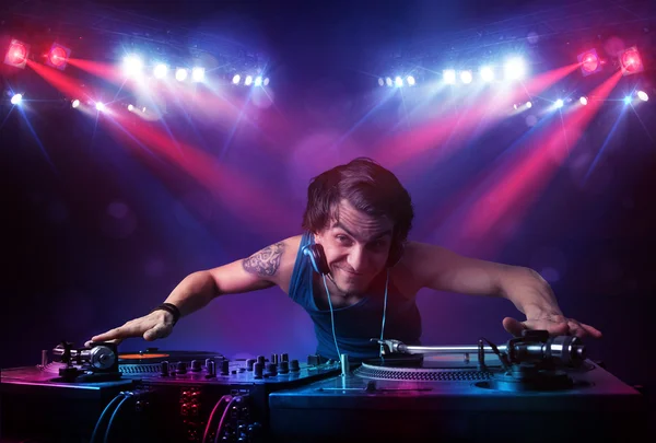 Teenager dj mixing records in front of a crowd on stage — Stock Photo #37478279