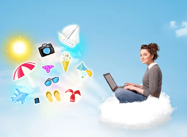 Young businessman sitting in cloud with laptop