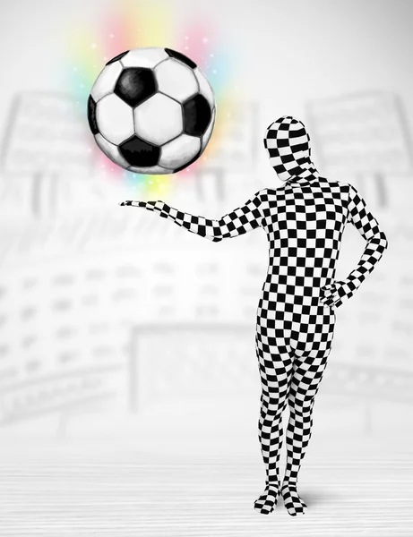 Man in full body suit holdig soccer ball