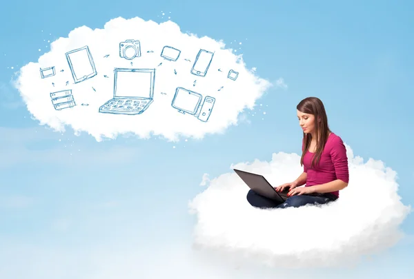Young woman sitting in cloud with laptop — Stock Photo #42374829