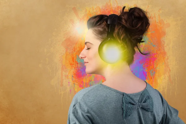 Young woman with headphones listening to music