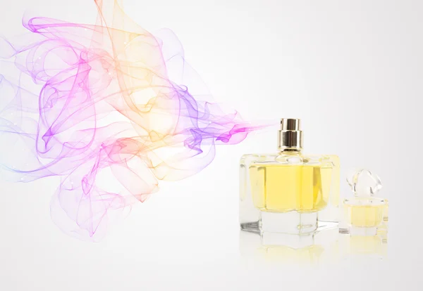 Perfume bottle spraying colored scent