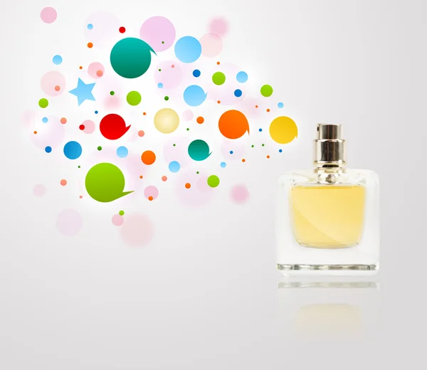 Perfume bottle spraying colored bubbles