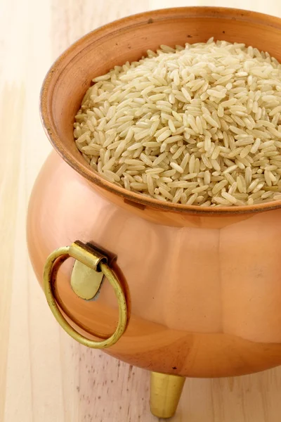 Brown rice on copper pot