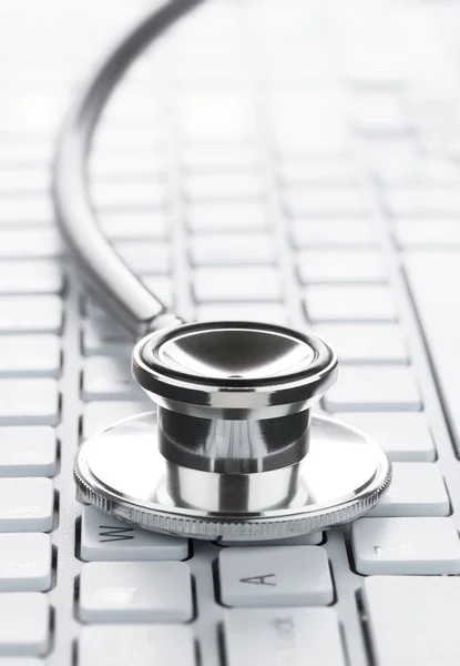 Stethoscope on the computer keyboard