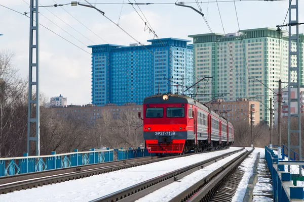A local train on snow covered tracks in Moscow