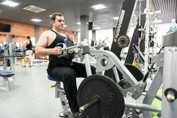 Man engaged in physical exercise in the gym