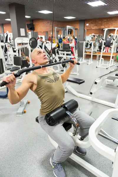 Man engaged in physical exercise in the gym