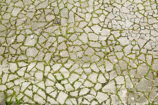 The top view on a cobblestone road