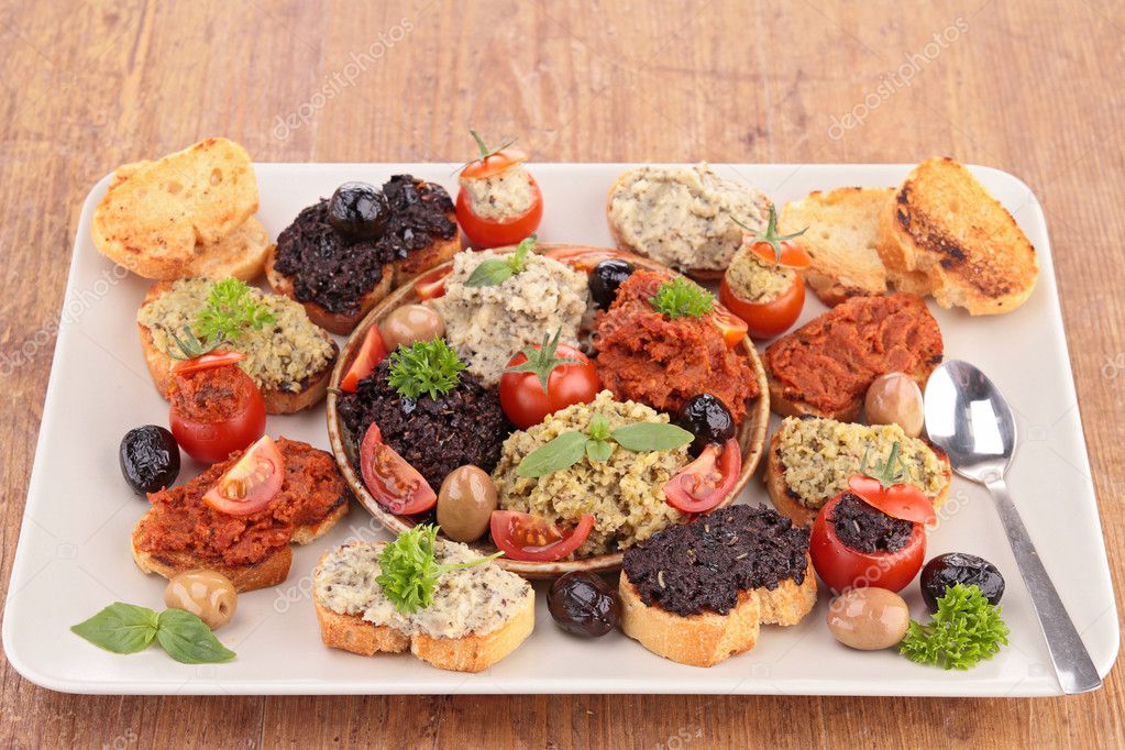 Canape with olive tapenade — Stock Photo © studioM 30485153