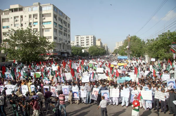 Residents of Karachi are chant slogans for recovery of missing persons during a protest demonstration arranged by Muttehida Qaumi Movement (MQM)