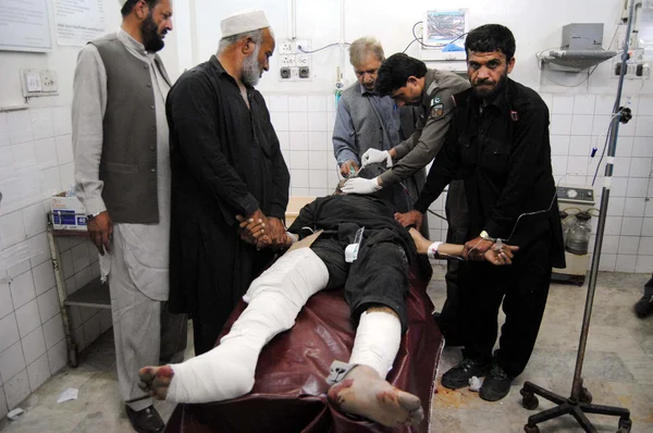 Victim of powerful bomb explosion occurred near the Custom House at the Torkham border crossing being admitted for treatment at local hospital in Peshawar