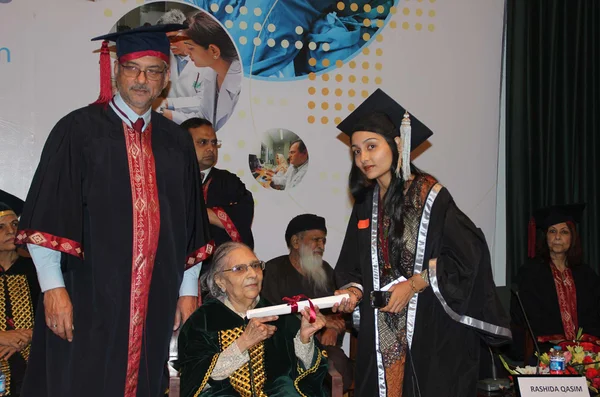 Anita Ghulam Ali awarding certificates among graduates students who passed Physician Assistant degree program during first convention