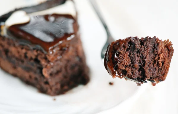 Piece of chocolate cake on the fork