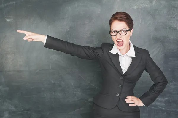 Angry teacher pointing out — Stock Photo #29683245