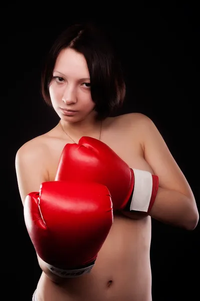 Beautiful nude girl with boxing gloves