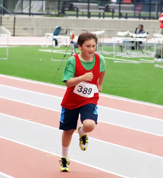 Boy on track and field competition