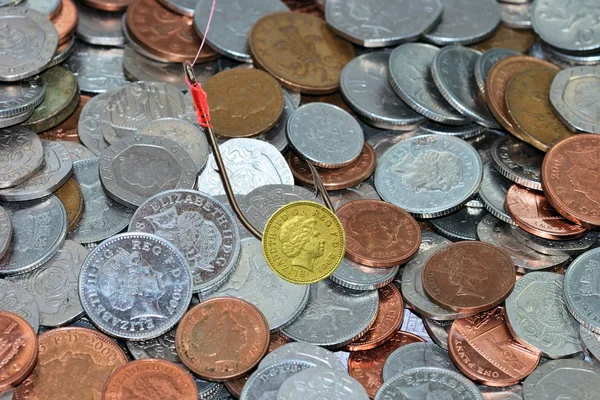 Pound coin as bait with coins in background