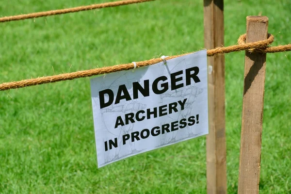 Archery in progress warning sign