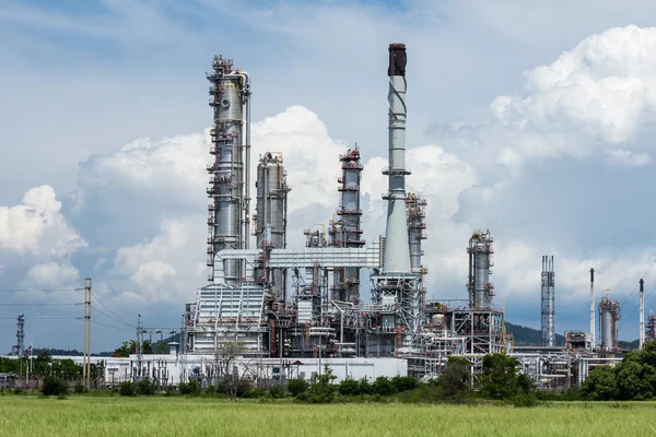 Oil refinery plant against blue sky