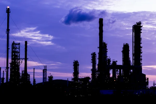 Silhouette of oil refinery plant at twilight morning