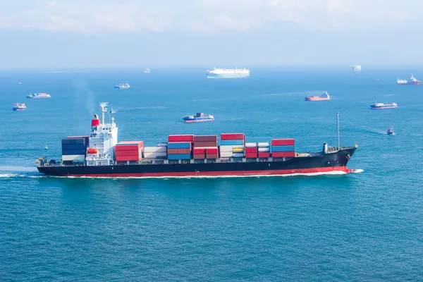 Cargo ship with containers sailing on the sea