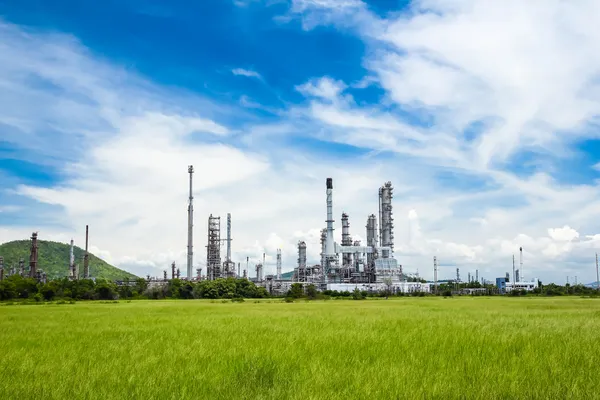 Oil refinery plant against blue sky