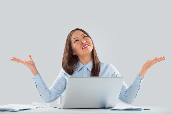 Happy business woman in the office celebrating success