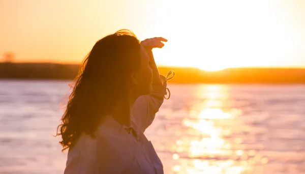 Enjoyment - free happy woman enjoying sunset