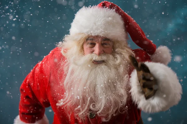 Santa Claus running outdoors at North Pole