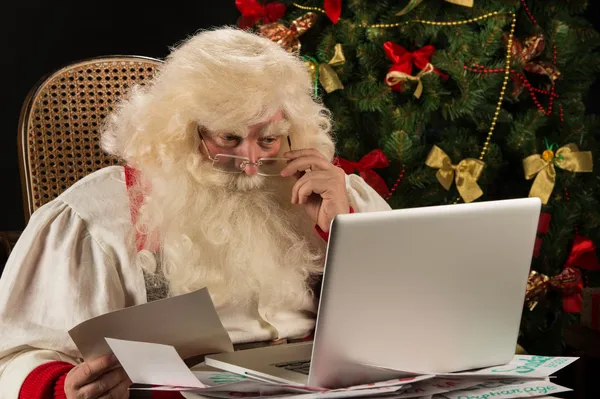 Santa Claus working on computer