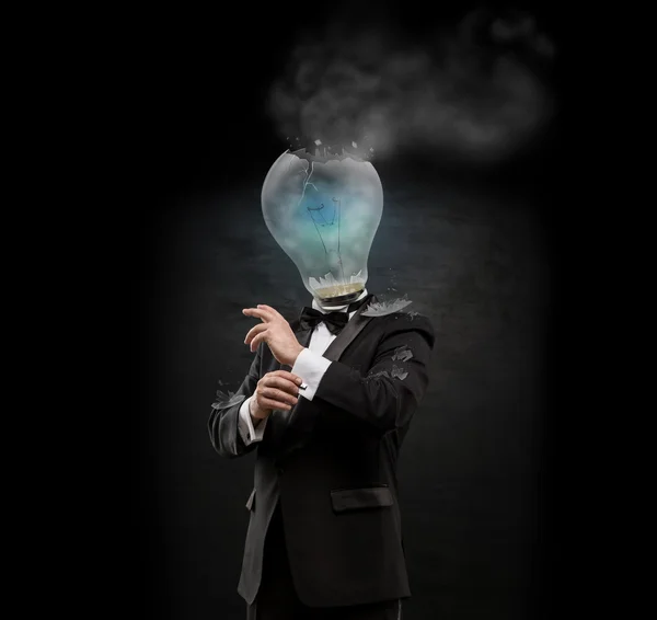 Overworked burnout business man standing headless with exploded bulb instead of his head. Strong stress concept