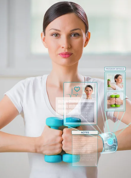 Woman doing exercise with dumbbells