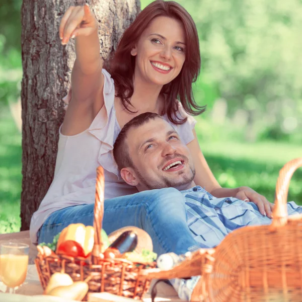 Adult couple picnicking