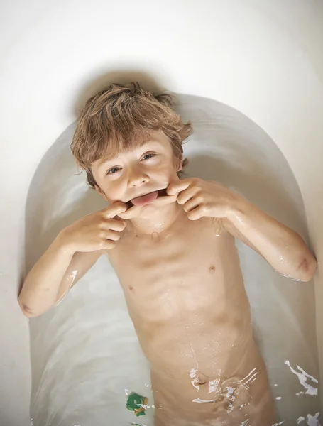 Boy making a funny face in bath — Stock Photo #25254511