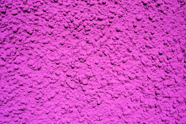 Wall of concrete with violet coating