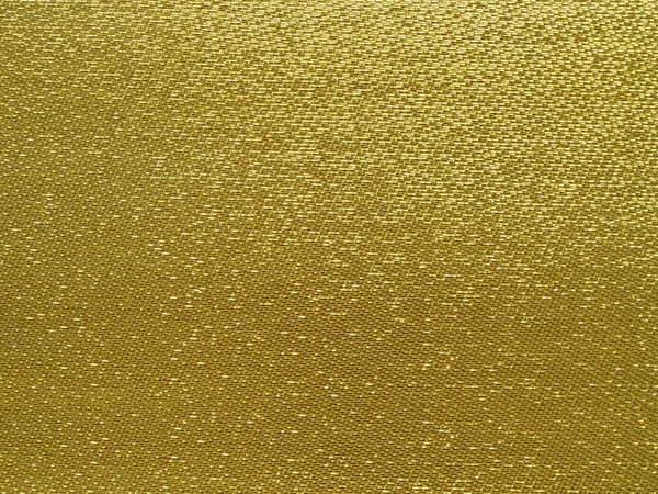 Gold thread on the fabric.