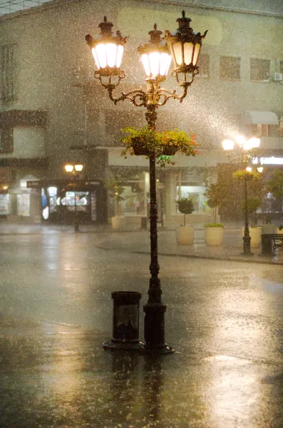 Image of old street lights in the rain