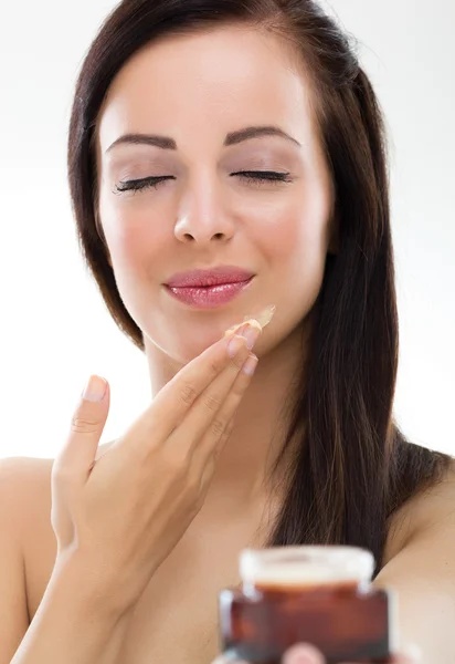 Woman applying cream