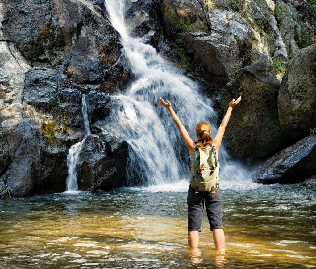 http://st.depositphotos.com/1030327/2410/i/950/depositphotos_24105485-stock-photo-female-hiker-looking-at-waterfall.jpg