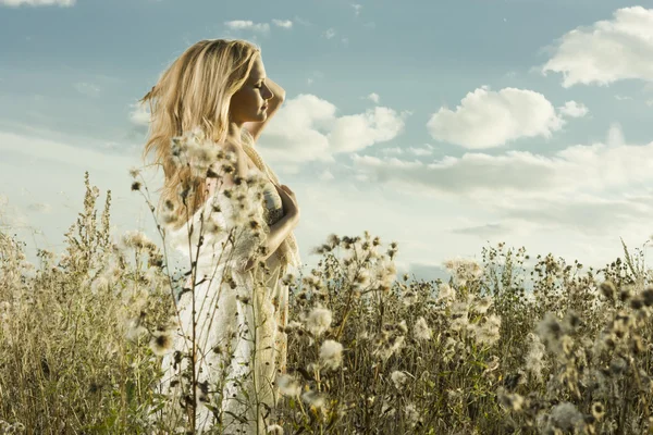 Portrait of a girl walking in field