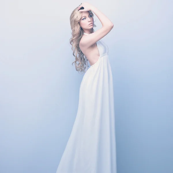 Portrait of beautifull woman standing in white dress