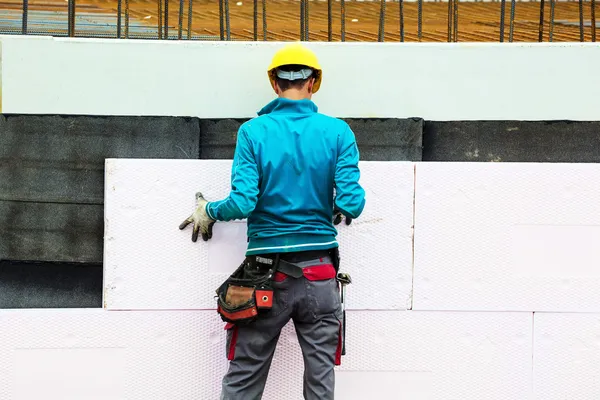 Construction workers and insulation