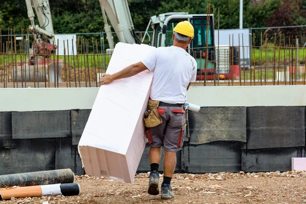 Construction worker with insulation — Stock Photo #14043269