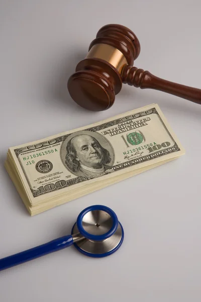 Stethoscope, Law gavel and us dollars
