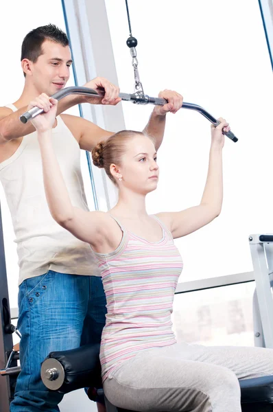 Gym man and woman doing exercise