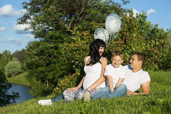 Happy family on nature background